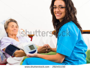 stock-photo-nurse-using-digital-blood-pressure-for-senior-patient-292451150